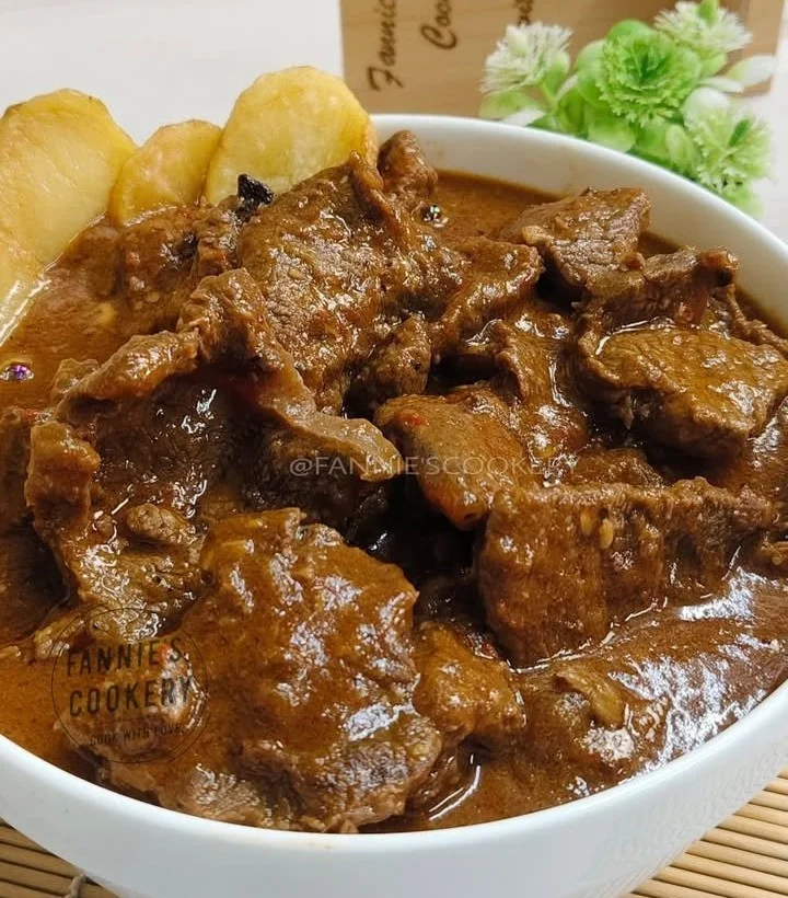 Succulent beef roast garnished with herbs, ready to serve for dinner.