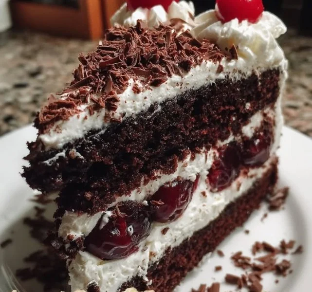 Delicious Black Forest Cake topped with cherries and whipped cream