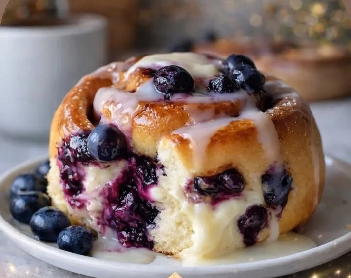 Delicious blueberry cheesecake rolls with fresh blueberries and creamy filling