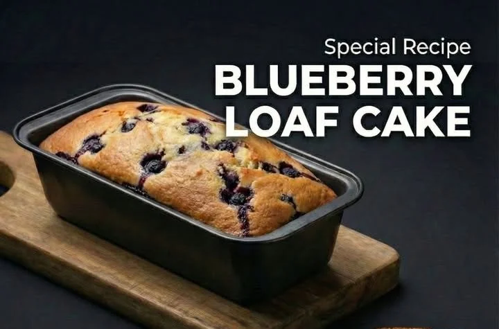 Delicious blueberry loaf cake with fresh blueberries on a wooden table