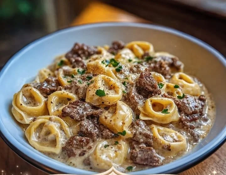 Delicious cheesesteak tortellini served in a creamy provolone sauce