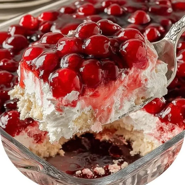 Cherries in the Snow dessert with whipped cream and cherries on top.