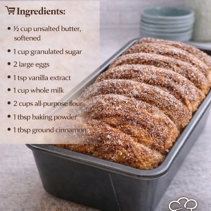 Freshly baked cinnamon donut bread on a wooden table
