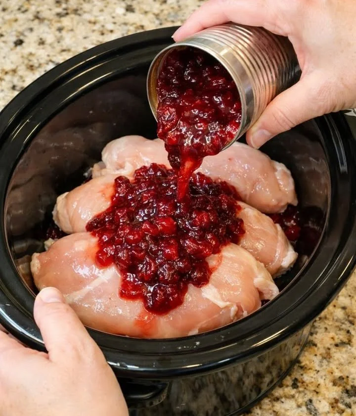 Cranberry Chicken dish with cranberries and herbs on a plate.