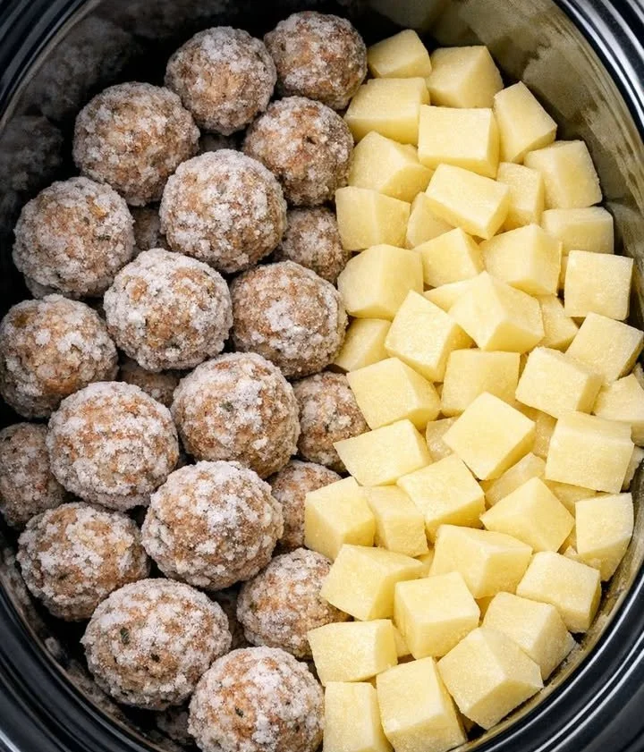 Crockpot meatballs with potatoes in a flavorful sauce.