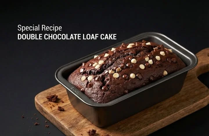 Delicious double chocolate loaf cake on a wooden table