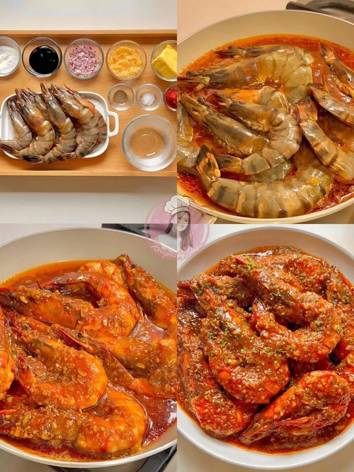 Delicious garlic butter prawns served on a plate with herbs.