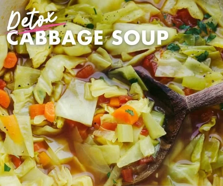 Bowl of healthy vegetable soup with colorful veggies and herbs