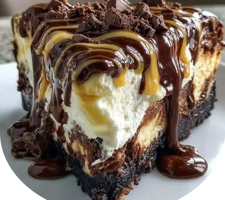 Delicious Hot Fudge Sundae Brownie Cheesecake topped with chocolate sauce.