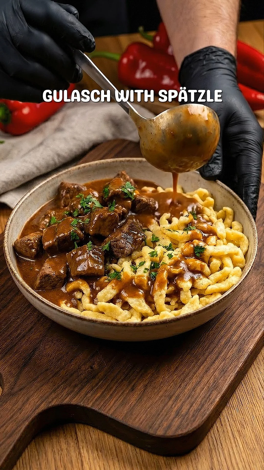 Delicious Hungarian Goulash served with Spätzle on a rustic table