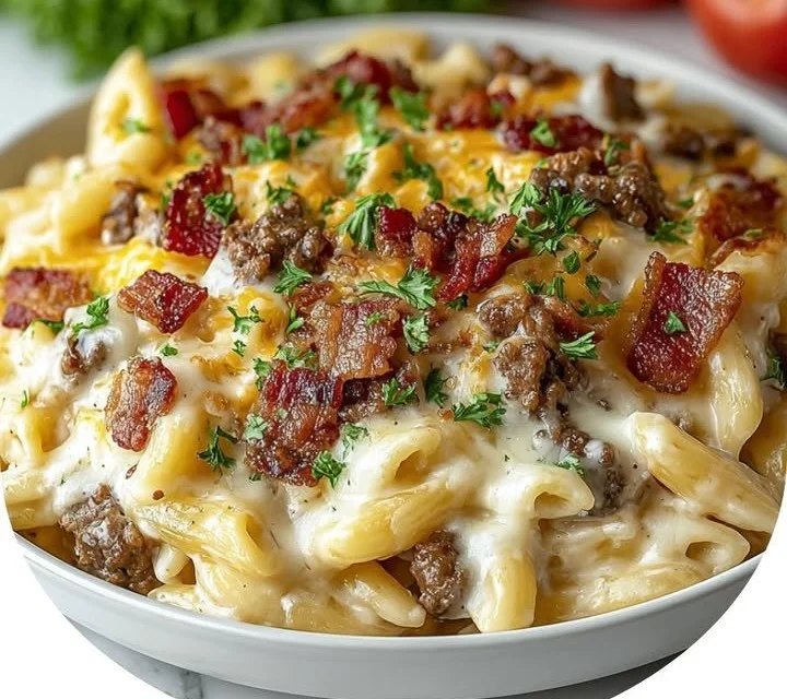 Loaded Bacon Cheeseburger Alfredo Pasta topped with crispy bacon and cheese