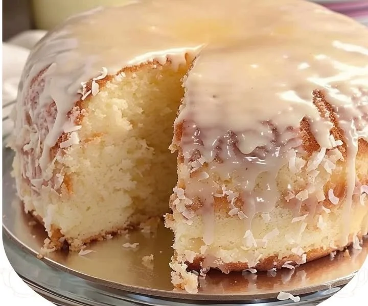 Pina Colada Pound Cake topped with coconut and pineapple slices