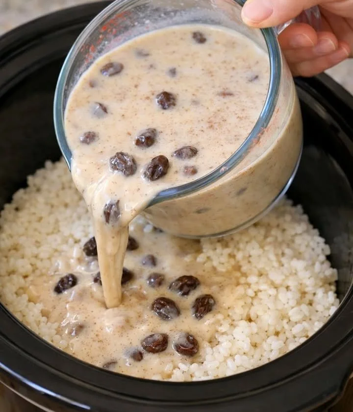 Delicious slow cooker rice pudding served in a bowl with cinnamon on top