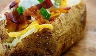 Crispy air fryer baked potato served with toppings