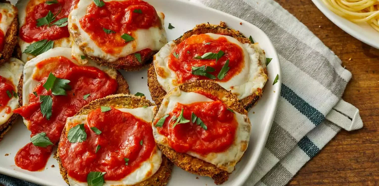 Delicious Air Fryer Eggplant Parmesan served with fresh basil.