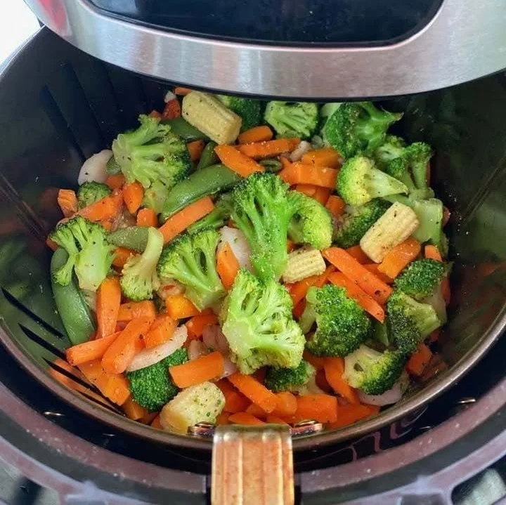 Crispy air fryer frozen vegetables ready to serve on a plate.