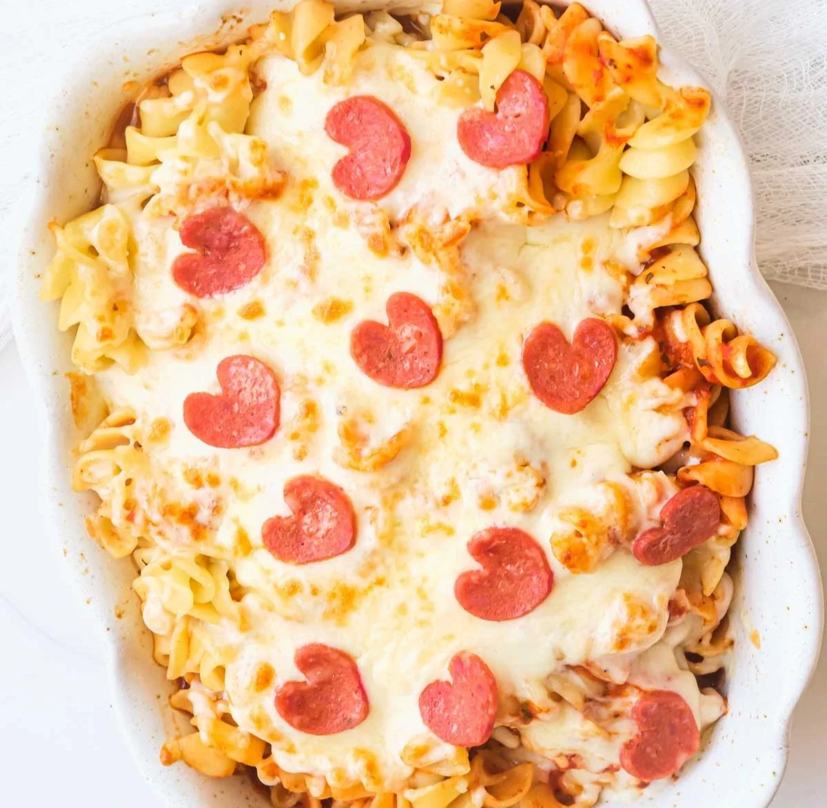Air Fryer Pizza Casserole served in a dish with cheesy toppings and pepperoni.