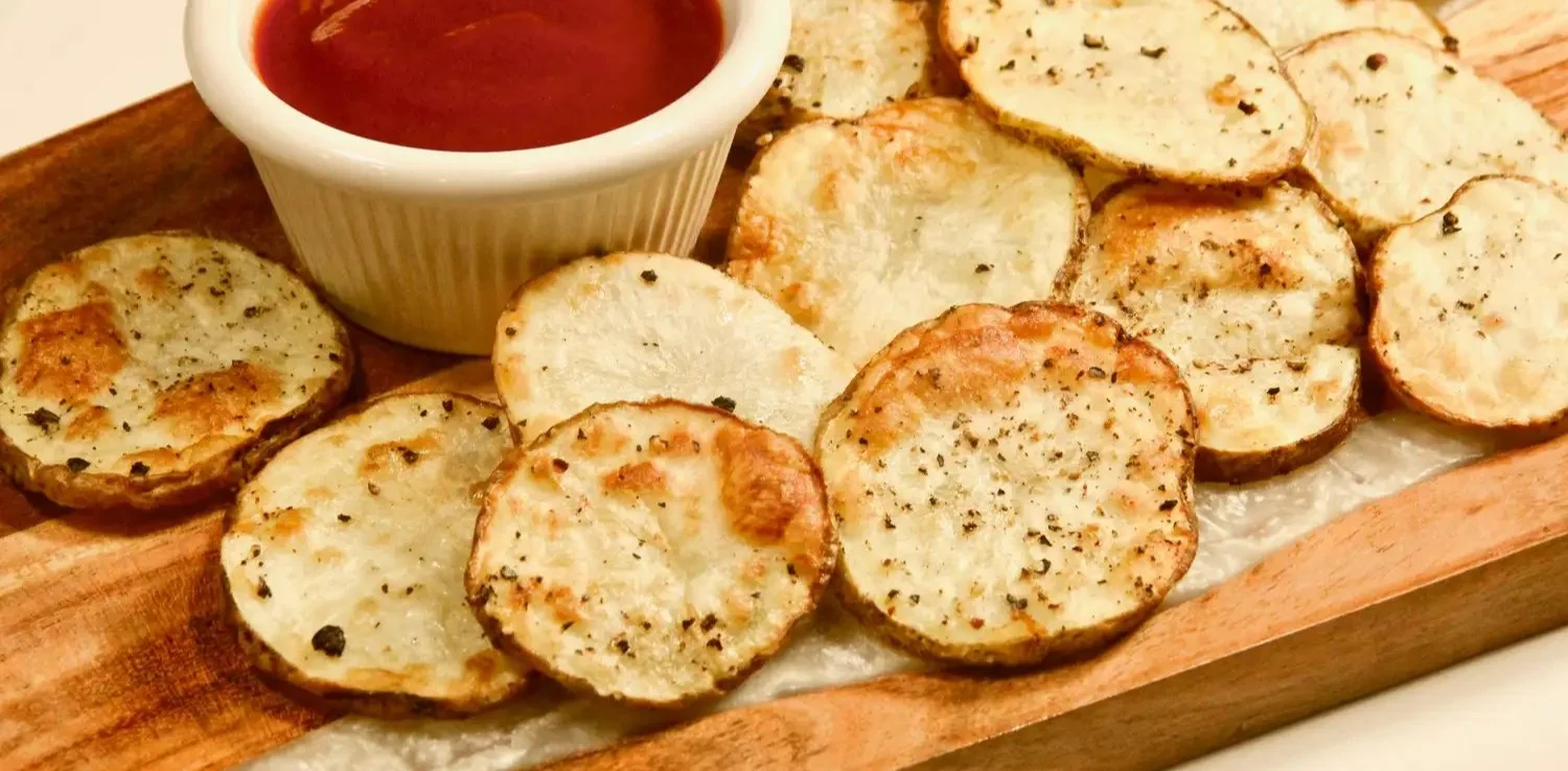 Crispy air fryer potato slices served with dipping sauce