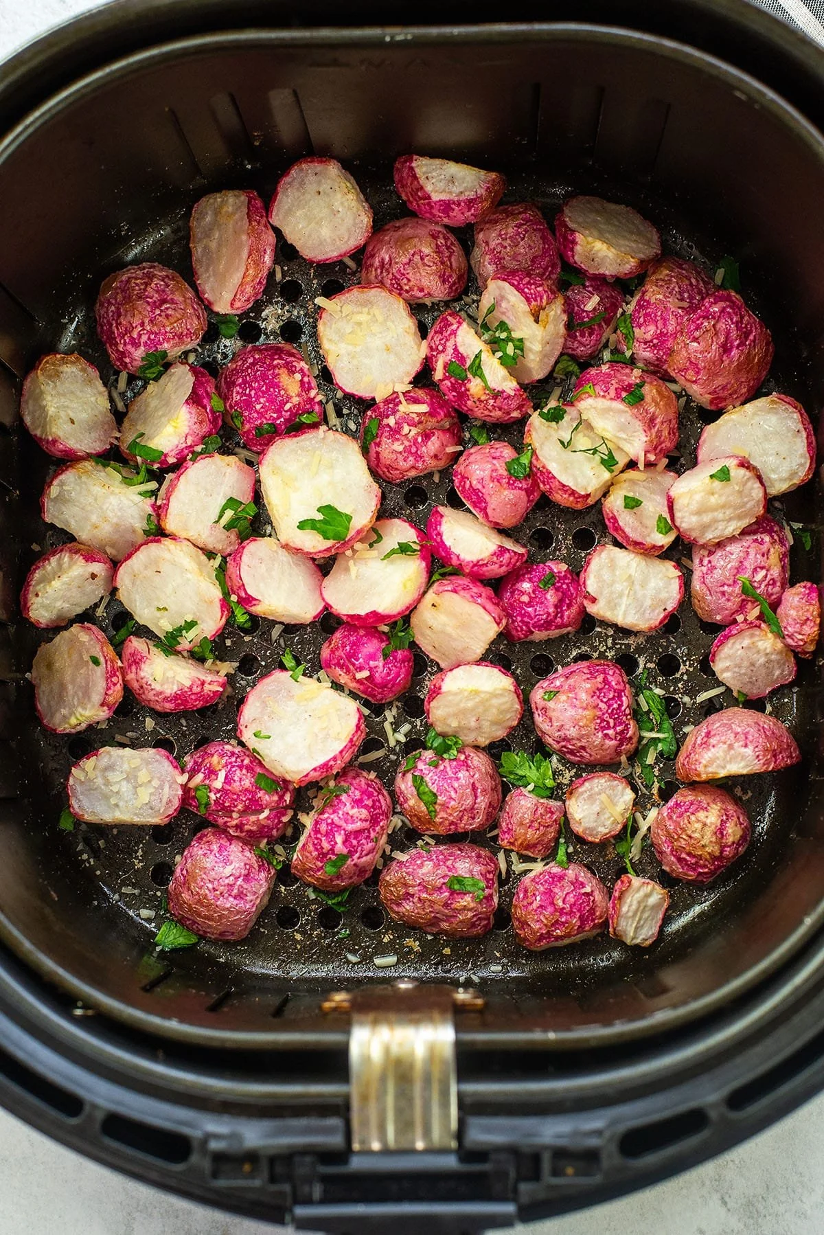 Crispy air fryer radishes served in a bowl