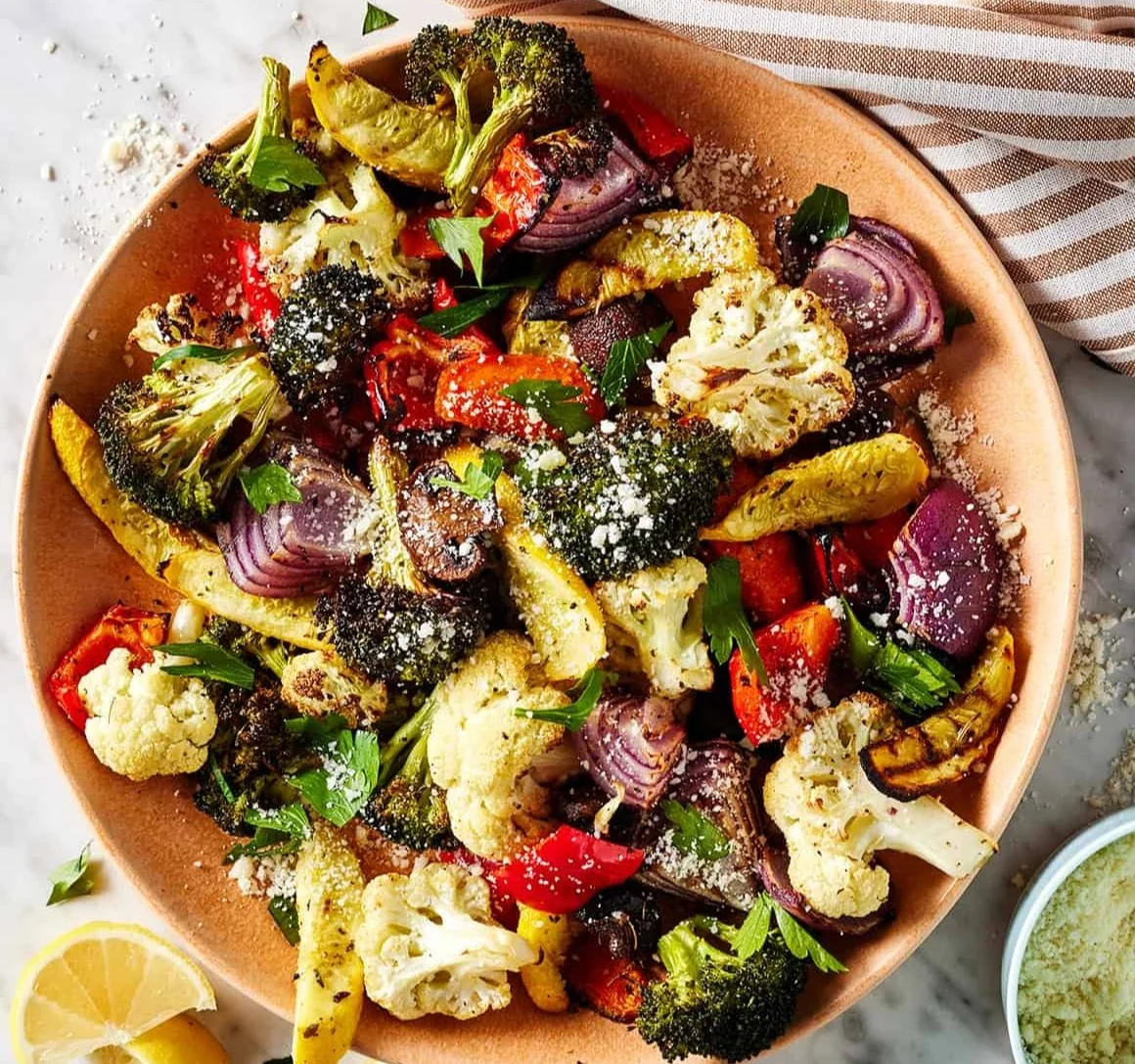 Colorful air fryer roasted vegetables including carrots, bell peppers, and zucchini.