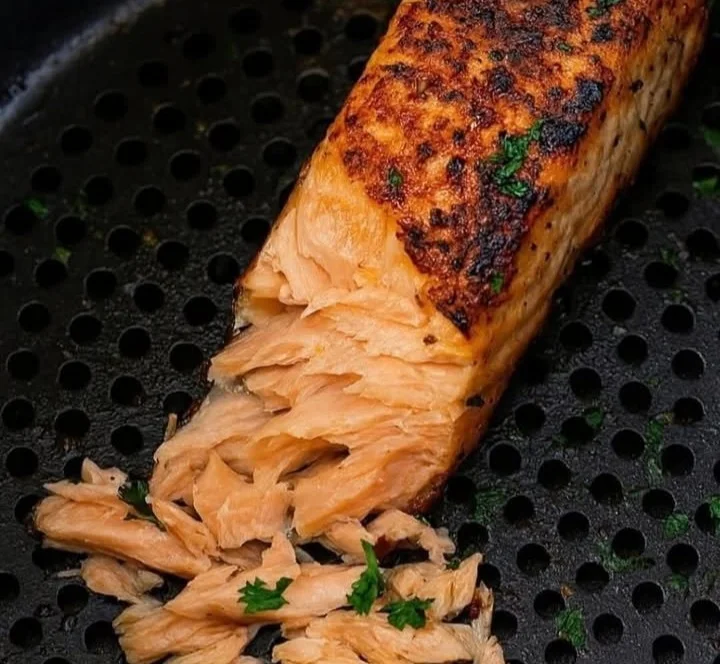 Air Fryer Salmon filets seasoned and ready to cook in an air fryer.