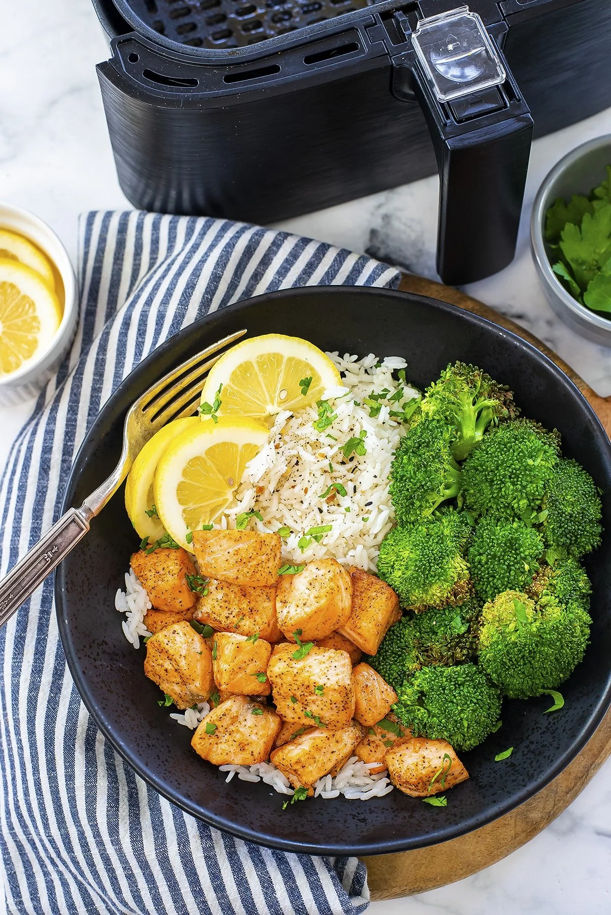 Delicious air fryer salmon bites served with dipping sauce.