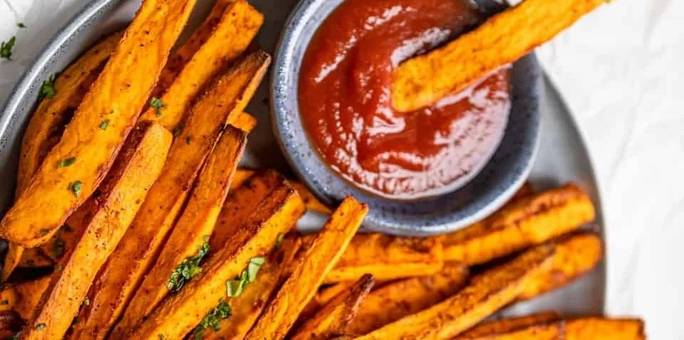 Delicious air fryer sweet potato fries served on a plate.