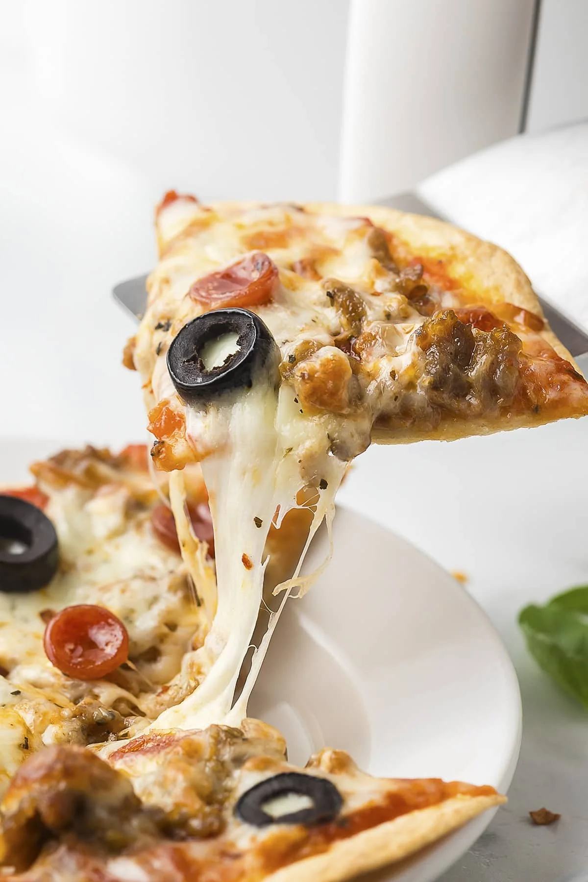 Delicious air fryer tortilla pizza topped with fresh ingredients