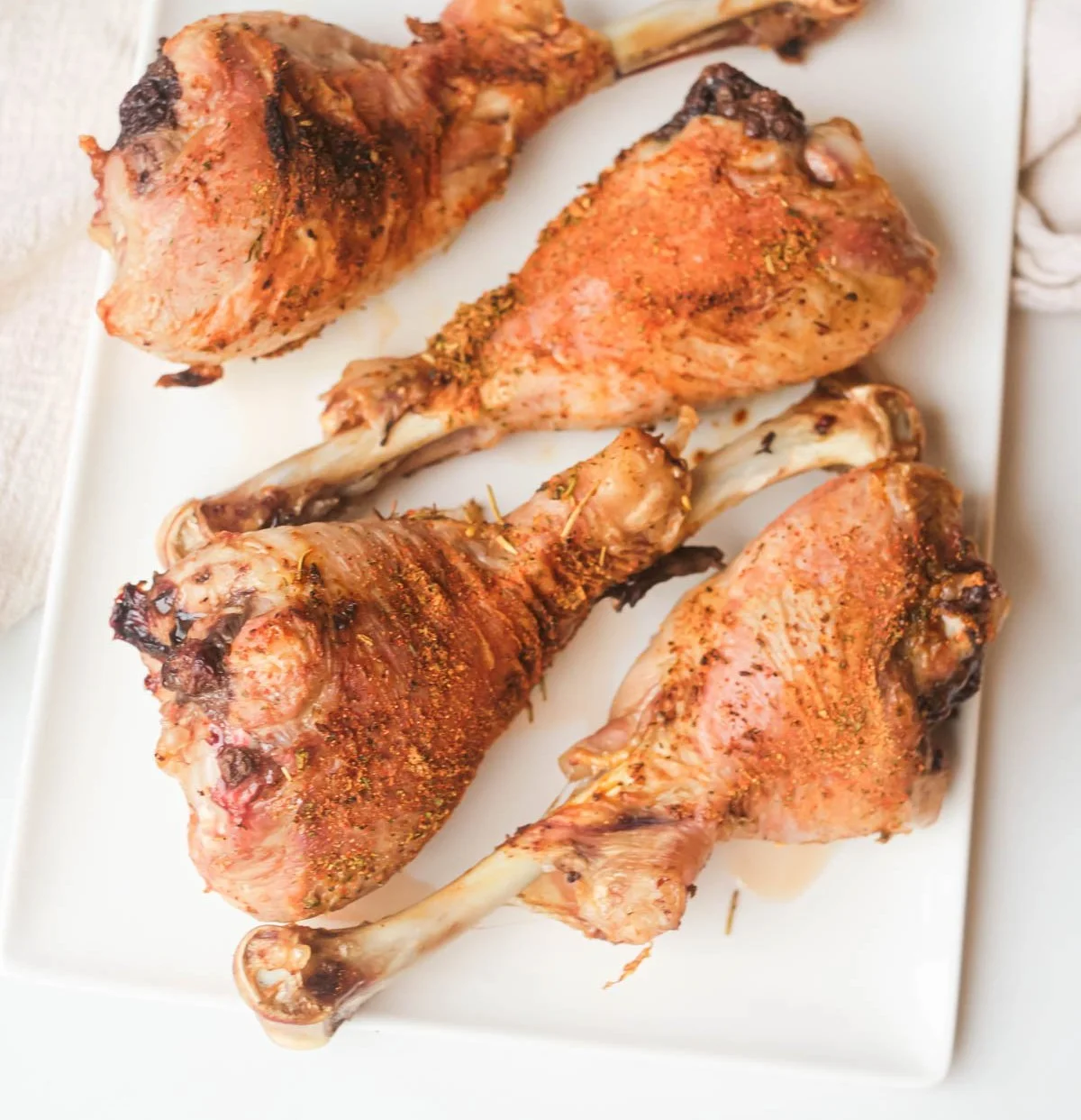 Crispy air fryer turkey legs served with seasoning