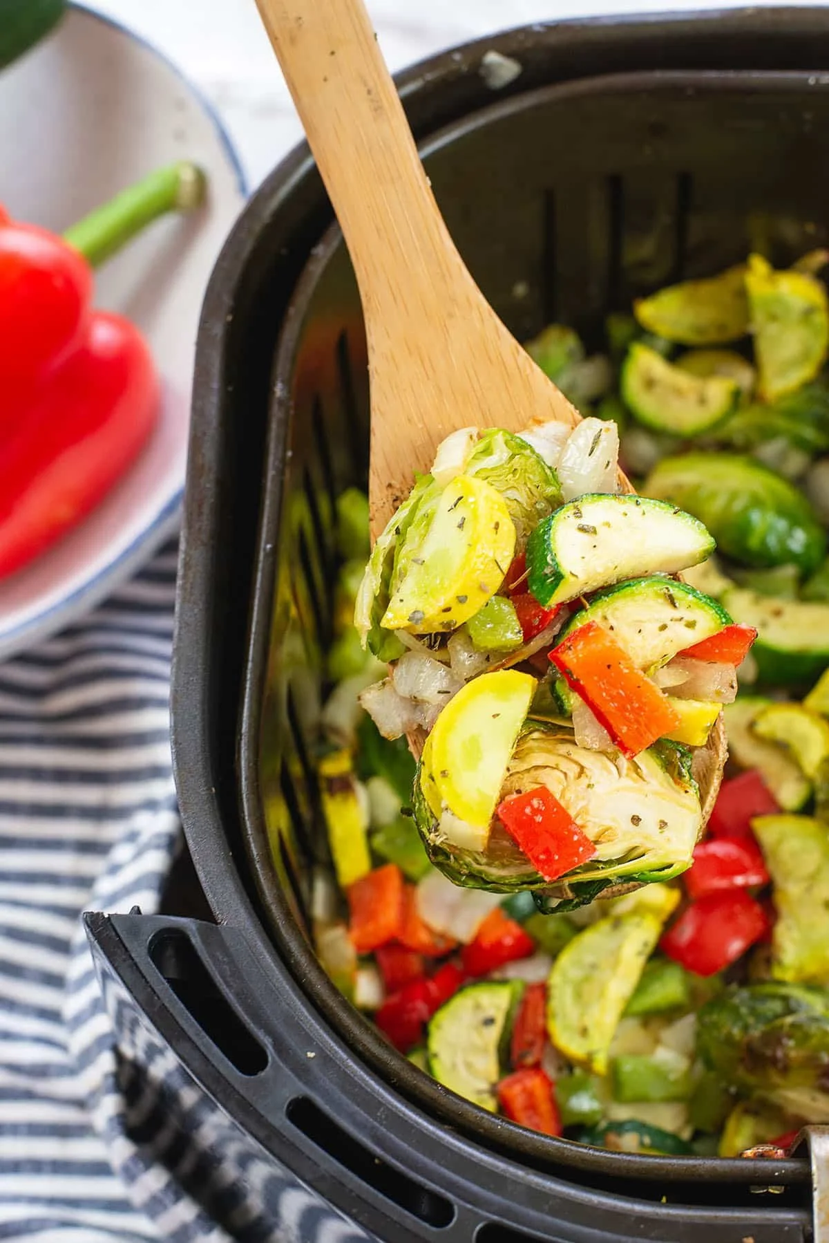 Crispy air fryer vegetables served in a bowl, showcasing a variety of colorful veggies.