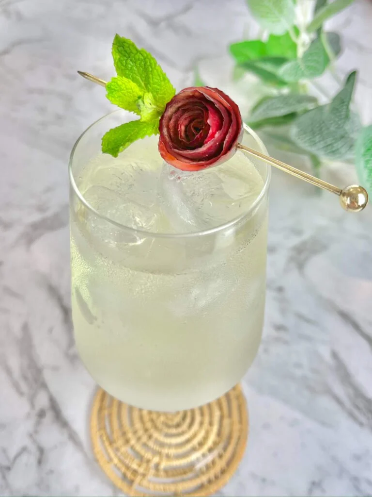 Beautifully crafted Apple Rose Garnish on a dessert plate.
