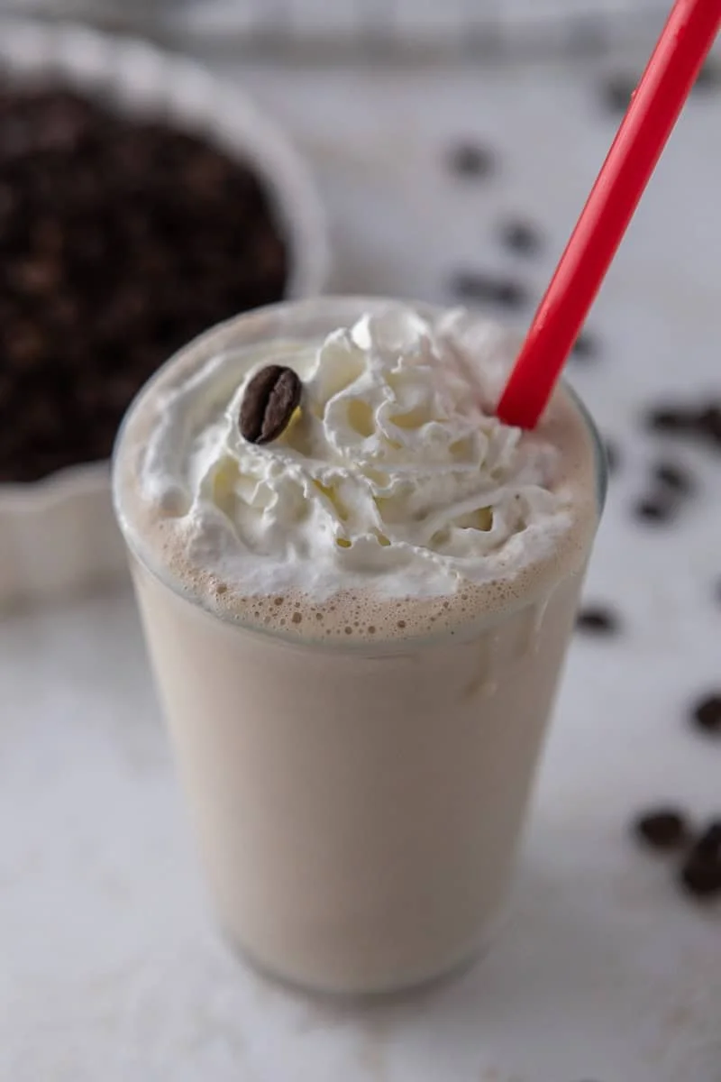 Homemade Chick Fil A Frosted Coffee in a glass topped with whipped cream