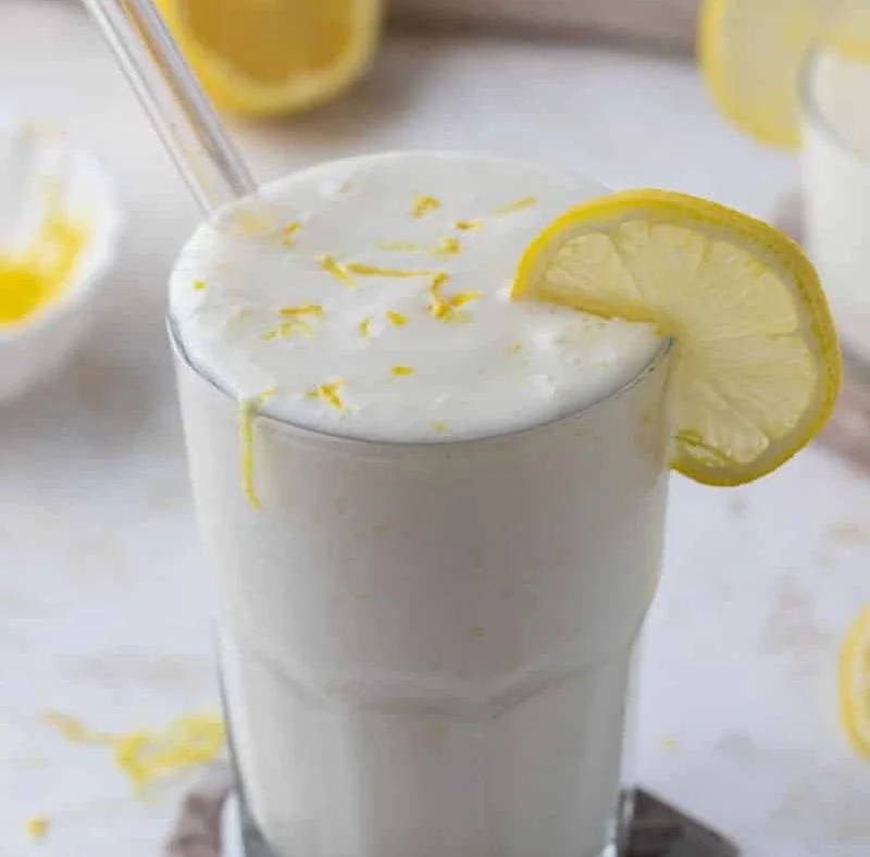 Chick-fil-A Frosted Lemonade in a clear cup with lemon garnish