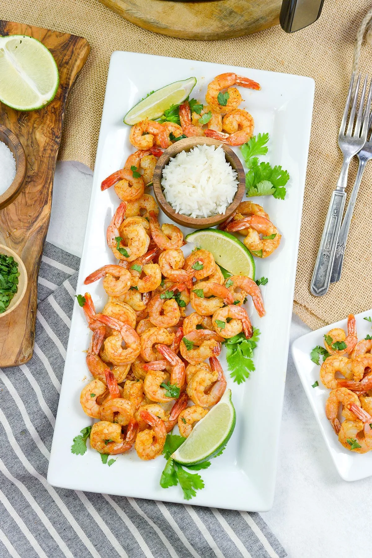 Plate of Chili Lime Shrimp garnished with lime and cilantro