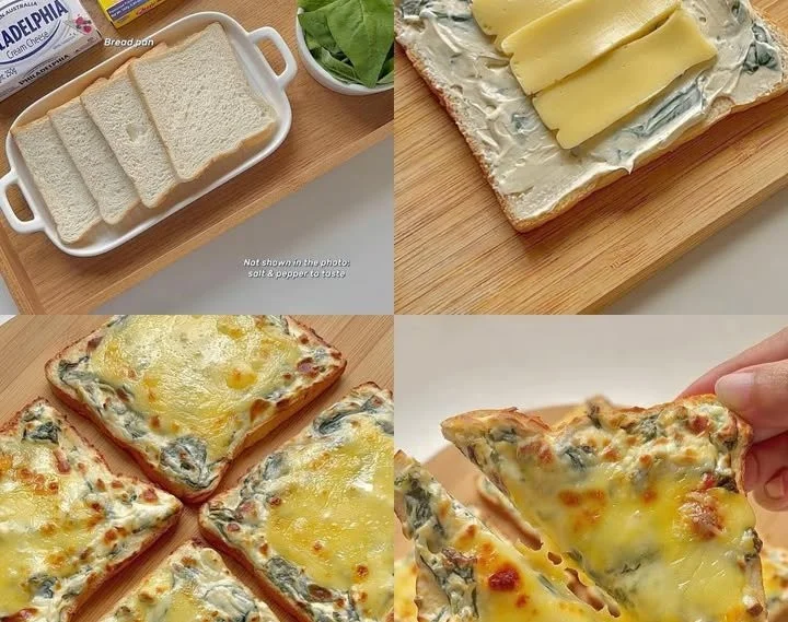 Creamy spinach pizza bread topped with melting cheese and fresh spinach.
