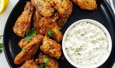 Juicy Greek chicken wings marinated in Mediterranean herbs and spices