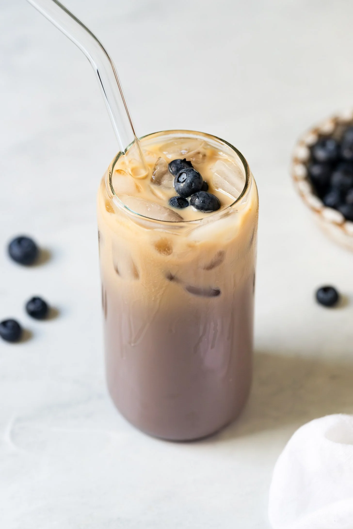 Delicious homemade blueberry iced latte with coffee and milk
