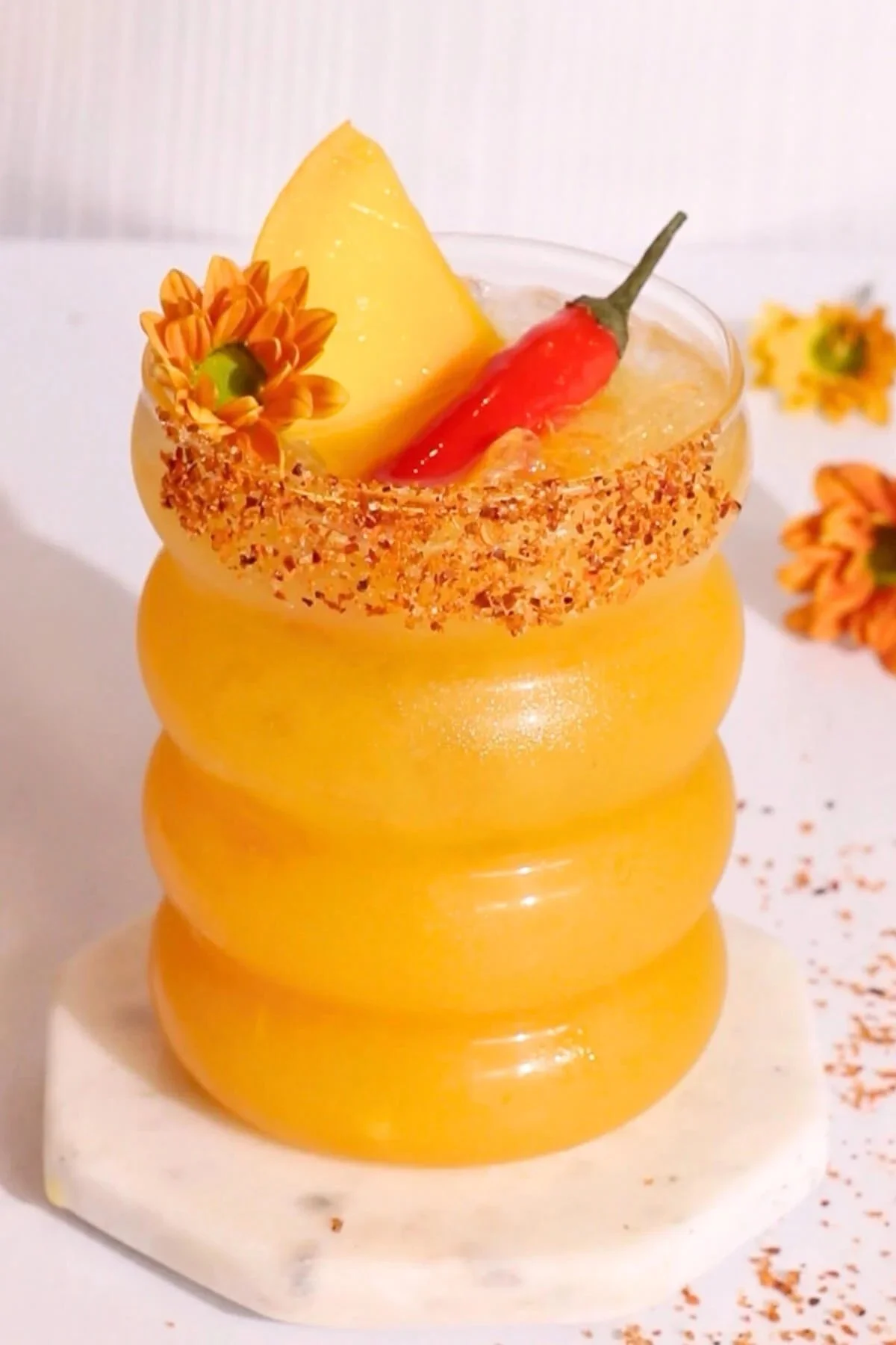 Delicious Hot Honey Mango Mocktail served in a glass with vibrant colors