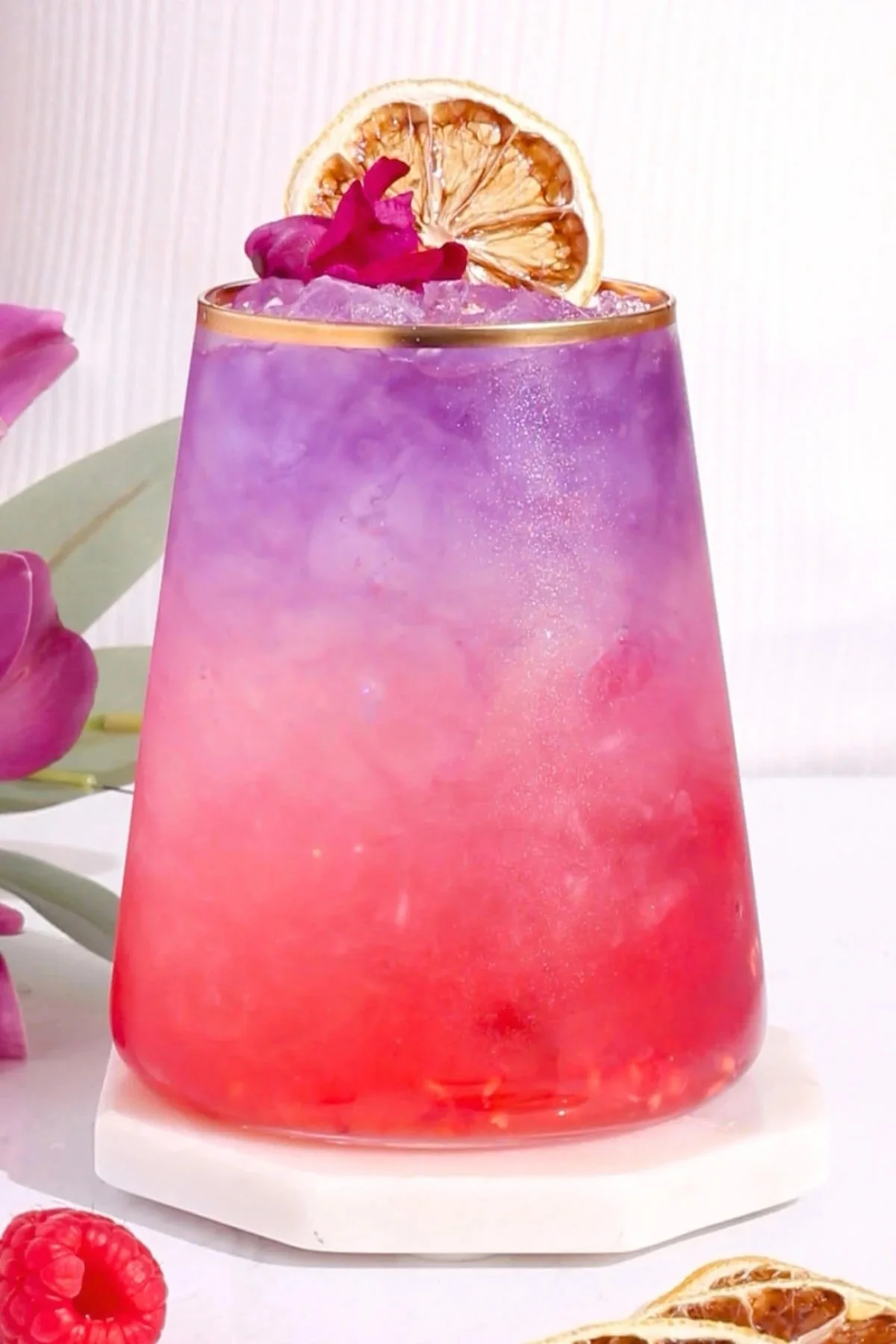 Kombucha mocktails with raspberry and lemon in a glass