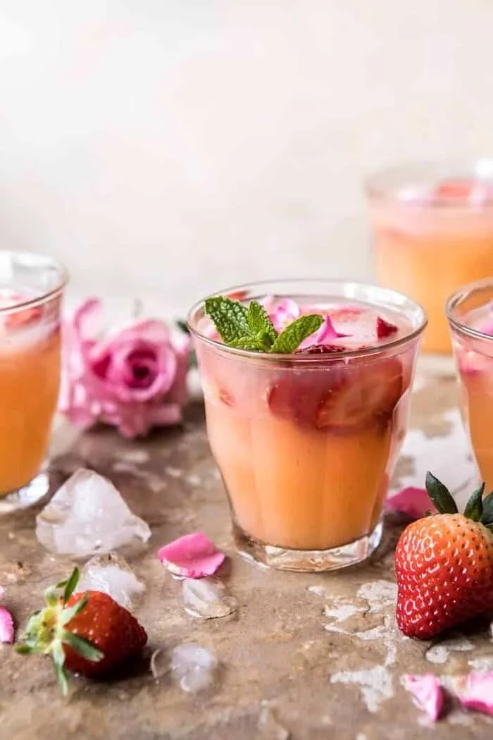 Minted Orange and Strawberry Coolers in a refreshing glass with mint leaves.