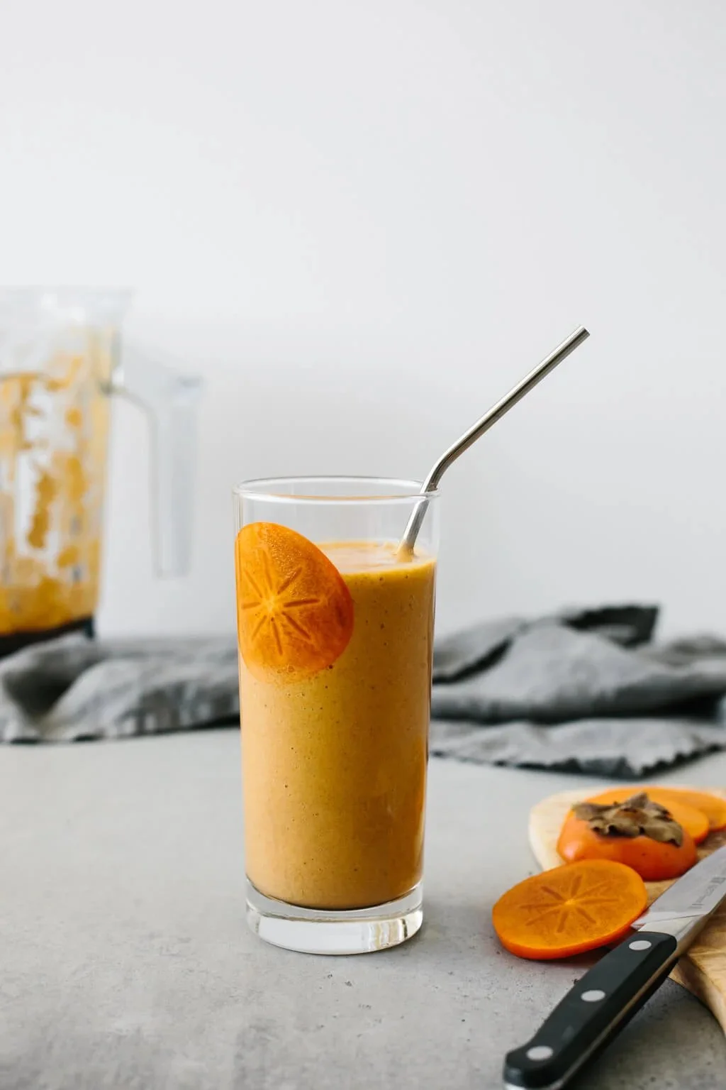 Creamy spiced persimmon smoothie with cinnamon and nutmeg ingredients