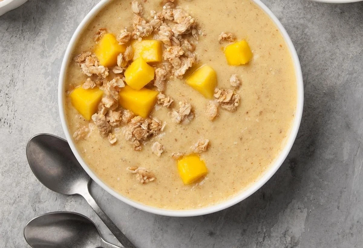 Delicious tropical smoothie bowl topped with fruits and granola