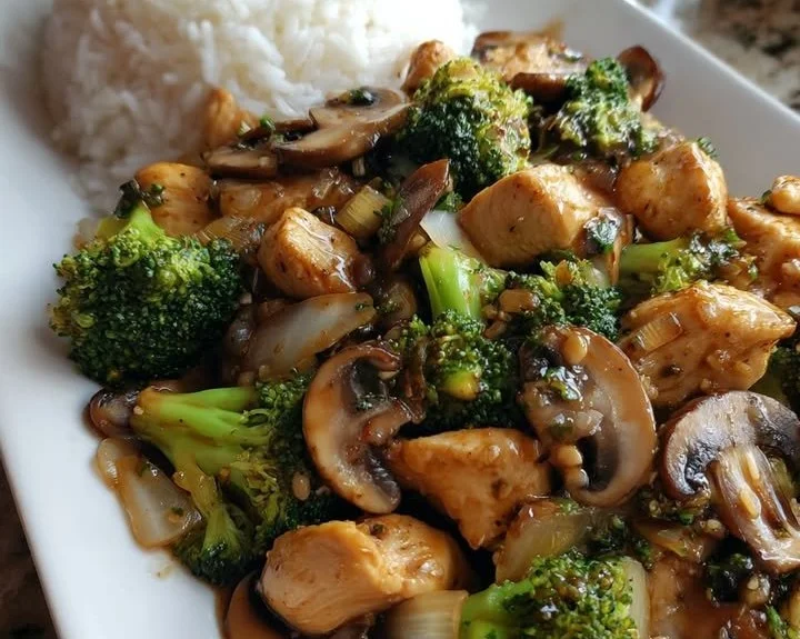 Ultimate chicken broccoli stir-fry with mushrooms served over rice