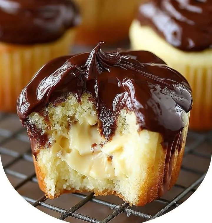 Delicious Boston Cream Pie Cupcakes with chocolate frosting and creamy filling