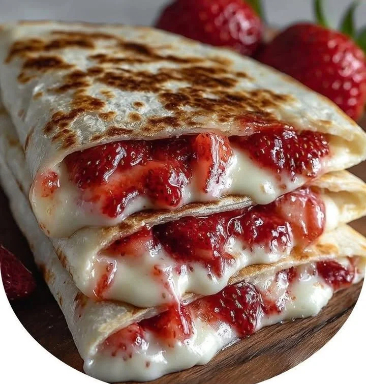 Delicious strawberry cheesecake quesadillas served with fresh strawberries