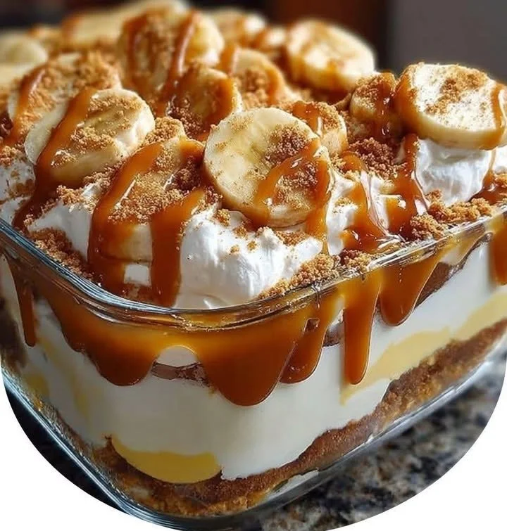 Delicious Biscoff banana pudding topped with caramel drizzle in a serving dish.