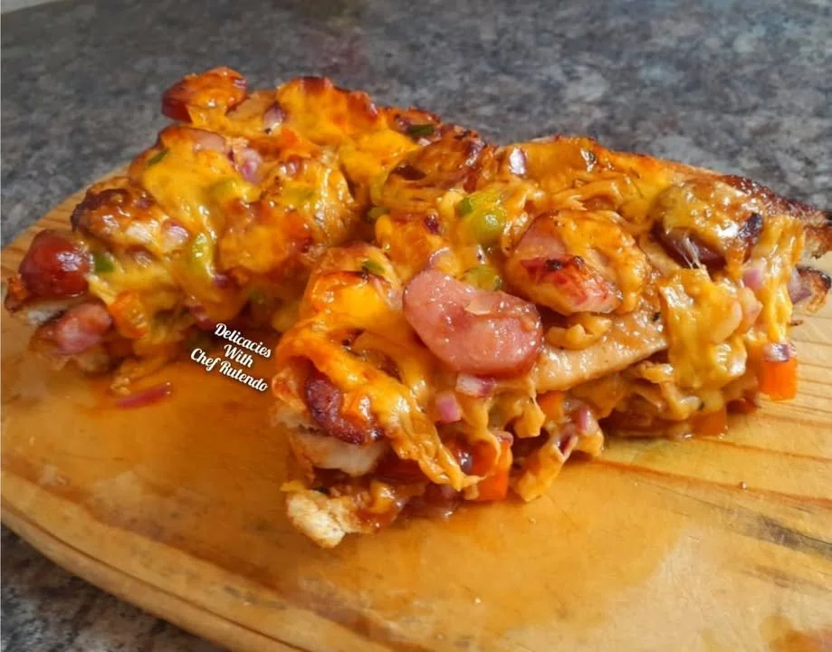 Delicious loaded bread pizza topped with cheese and fresh ingredients