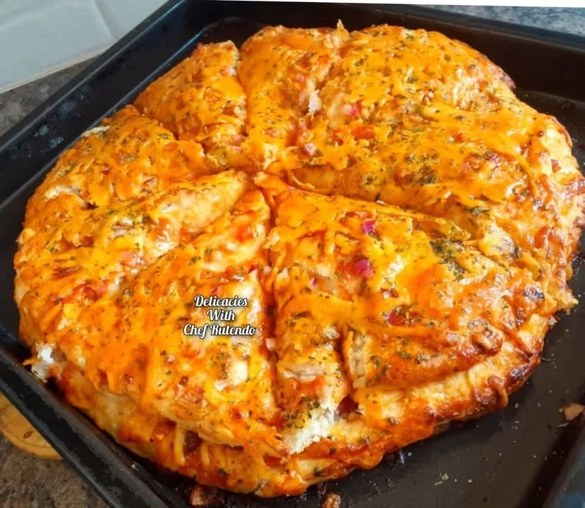 Triple Decker Homemade Pizza with layers of cheese and toppings