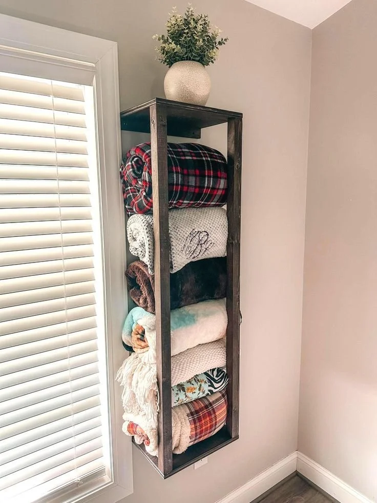 Rustic wall mounted blanket holder for stylish living room decor and storage